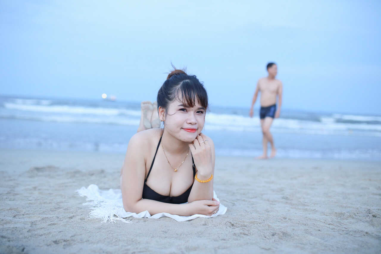 Sultry sirens on sun-kissed sands Exotic oriental beauties show off their curves in sexy swimwear - 