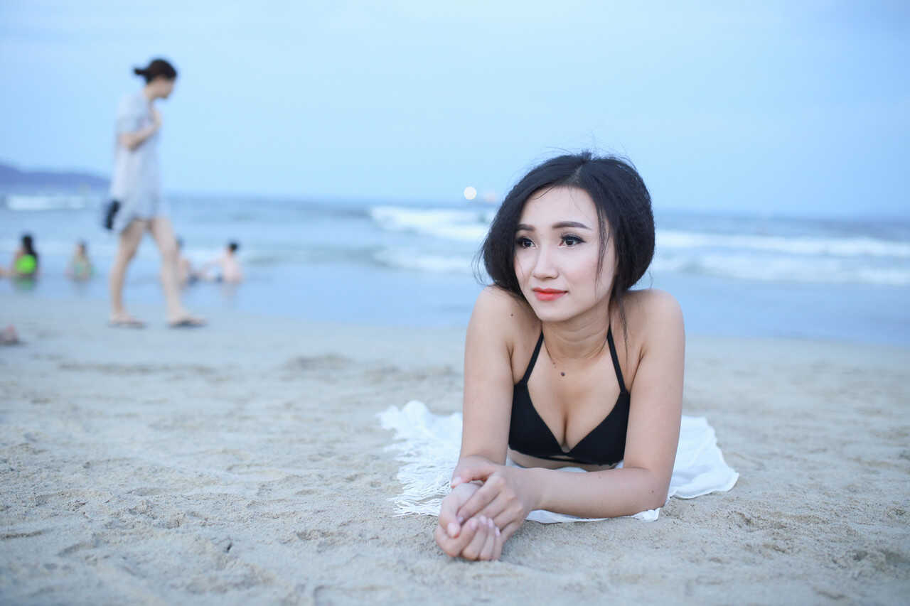 Sultry sirens on sun-kissed sands Exotic oriental beauties show off their curves in sexy swimwear - 