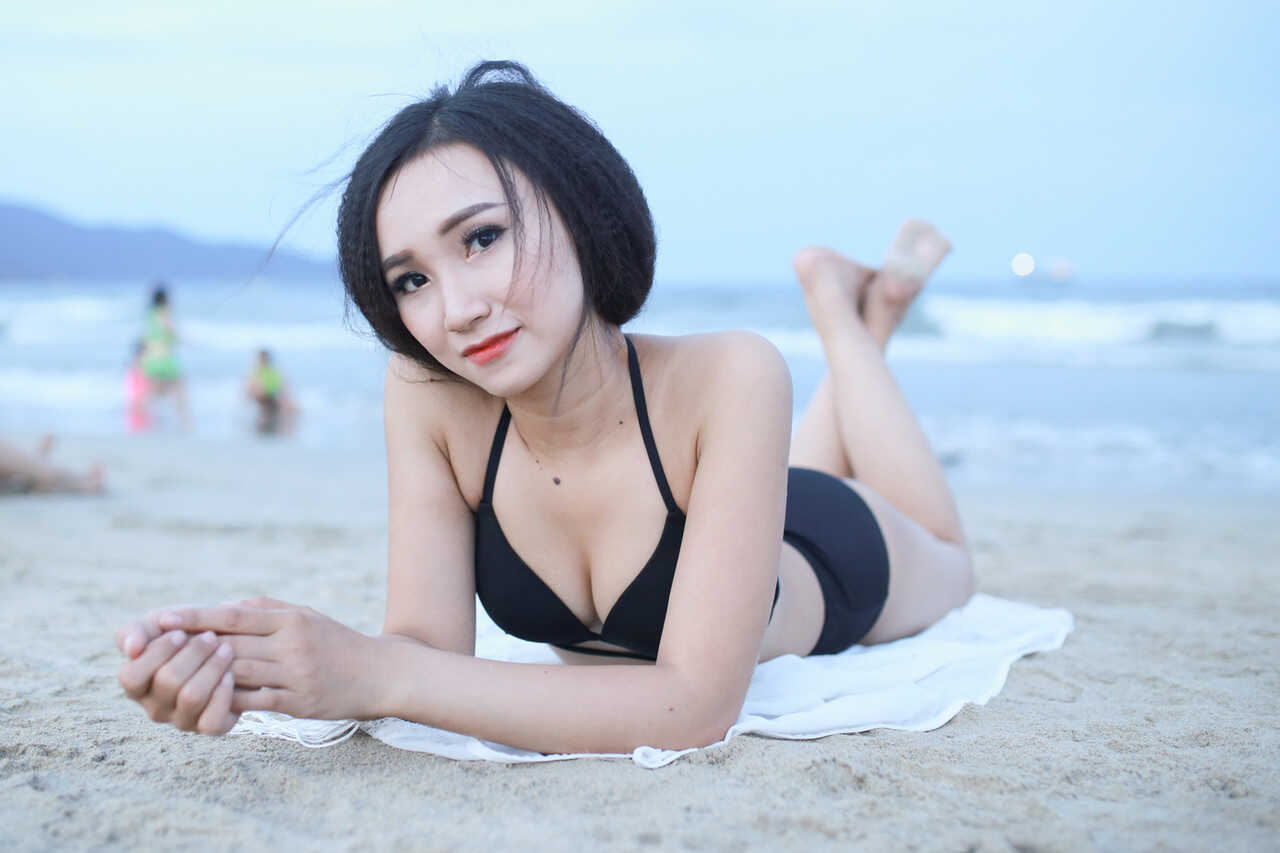 Sultry sirens on sun-kissed sands Exotic oriental beauties show off their curves in sexy swimwear - 