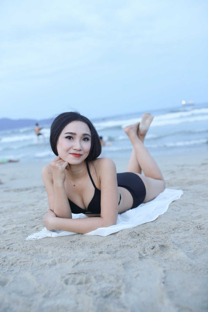 Sultry sirens on sun-kissed sands Exotic oriental beauties show off their curves in sexy swimwear - 