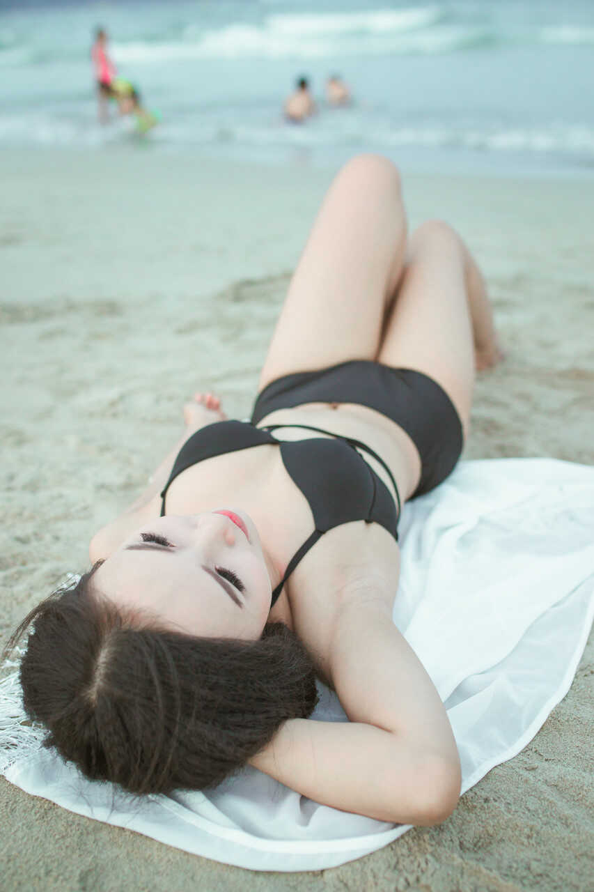 Sultry sirens on sun-kissed sands Exotic oriental beauties show off their curves in sexy swimwear - 