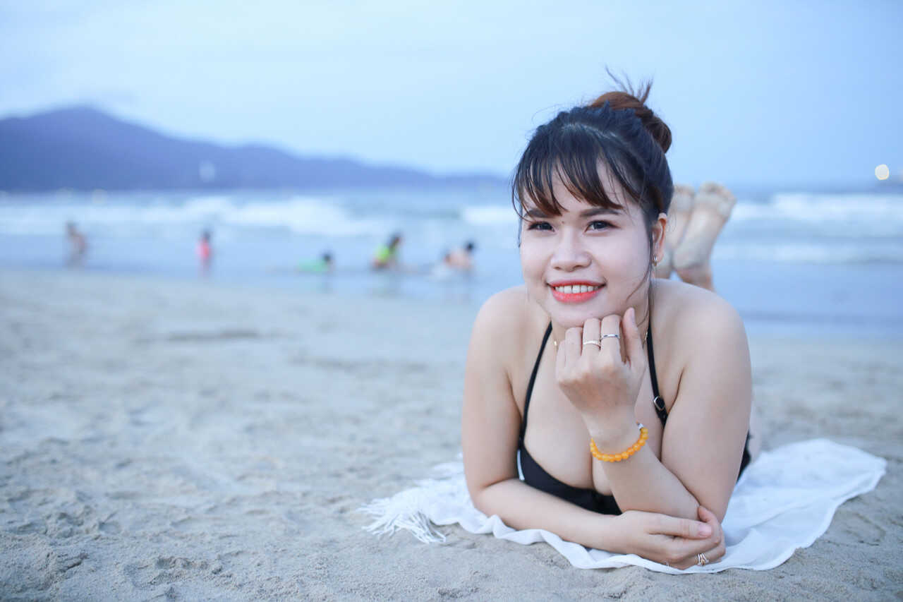 Sultry sirens on sun-kissed sands Exotic oriental beauties show off their curves in sexy swimwear - 