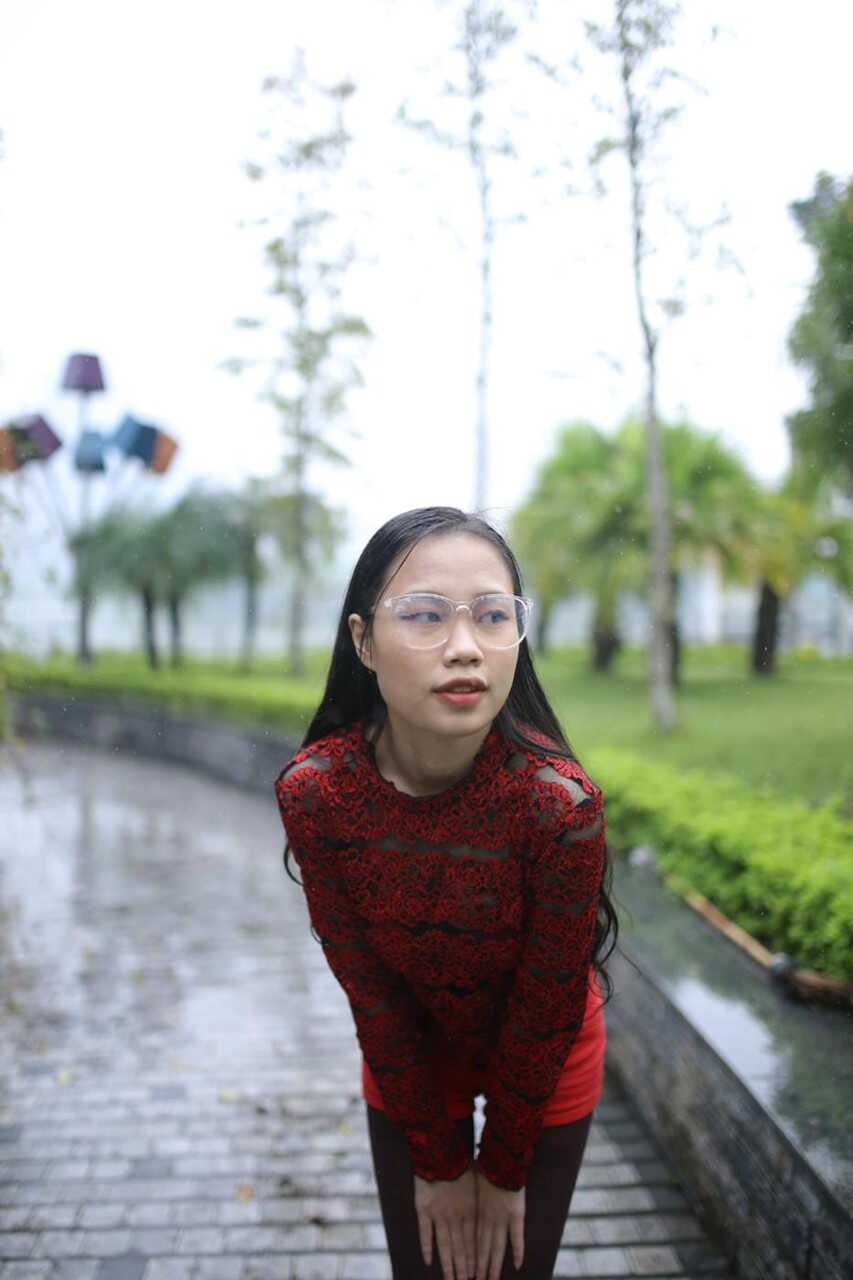 Naughty Asian Nerd in Public: Busty Brunette with Glasses Teases Passersby in Skintight Outfit