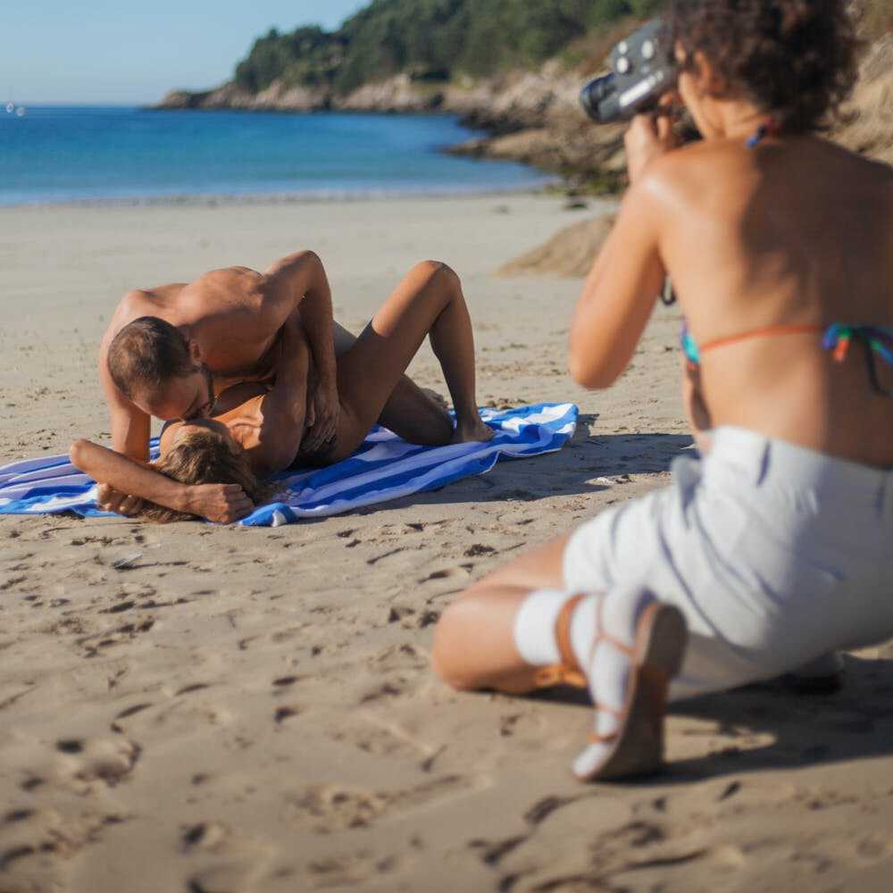 Iana Bet gets pounded hard on the sandy beach by Marc Morato, while being watched by a hidden camera - Marc Morato, Iana Bet
