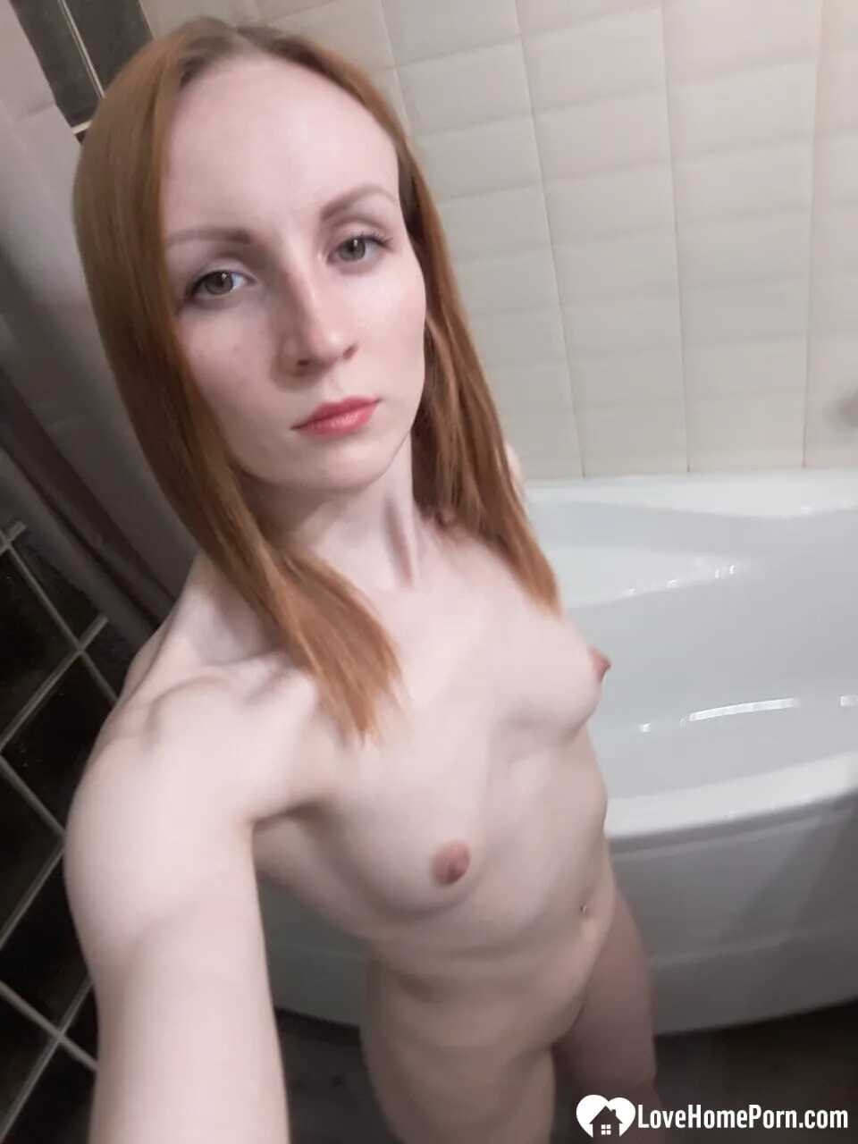 Naked Nympho Redhead Shows Off Her Petite Body In The Bathroom