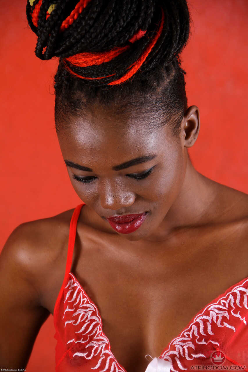 African teen Zola's skinny black pussy spreads wide for the camera while she strips off her red lingerie and shows of...