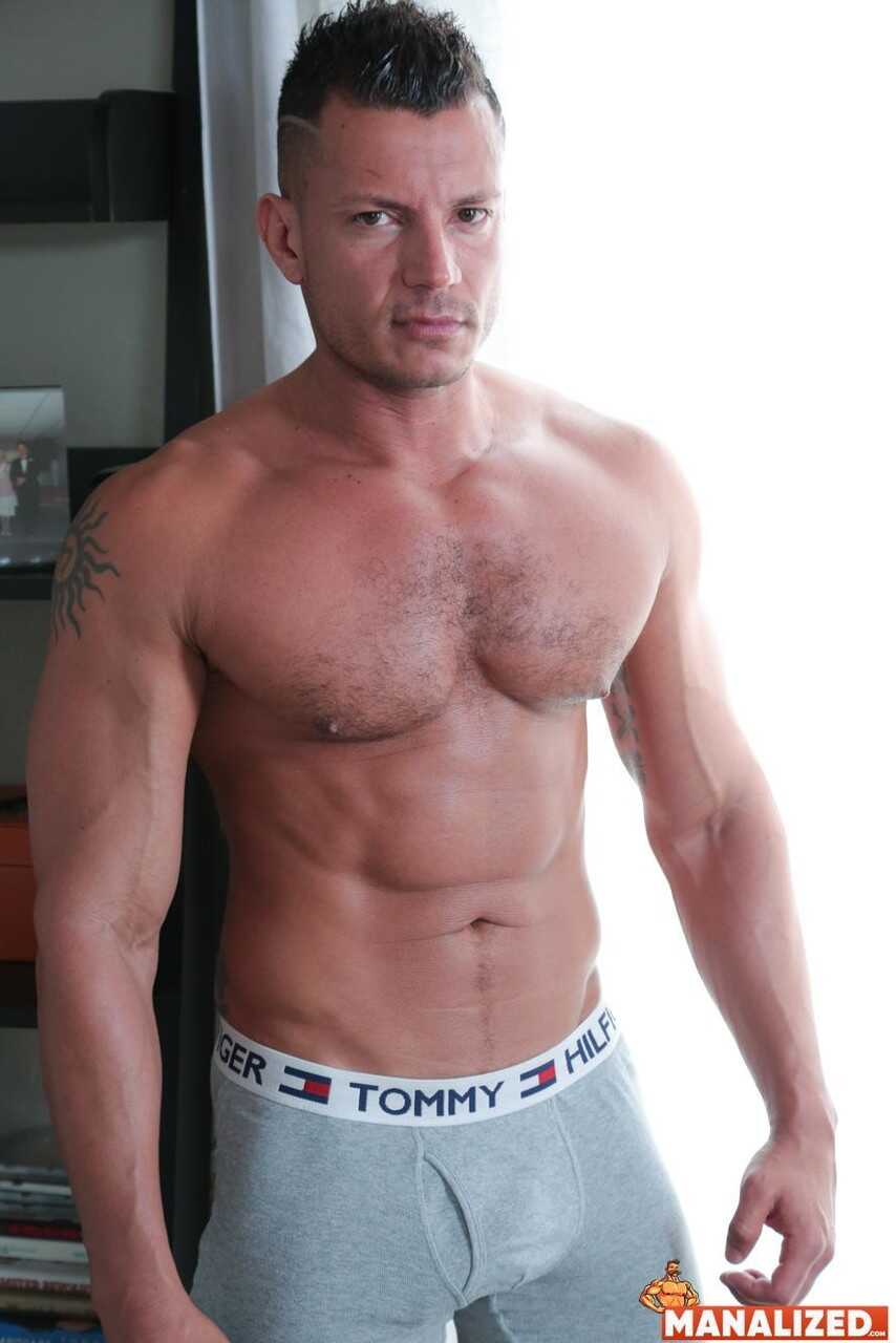 Horny gay bodybuilders Tex Davidson and Angelo Marconi engage in a steamy anal sex session while riding each other's ...