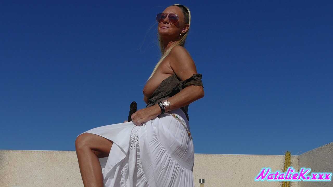 Busty MILF Natalie K rides the dildo hard, leaving no doubt about her sexual prowess! - Natalie K