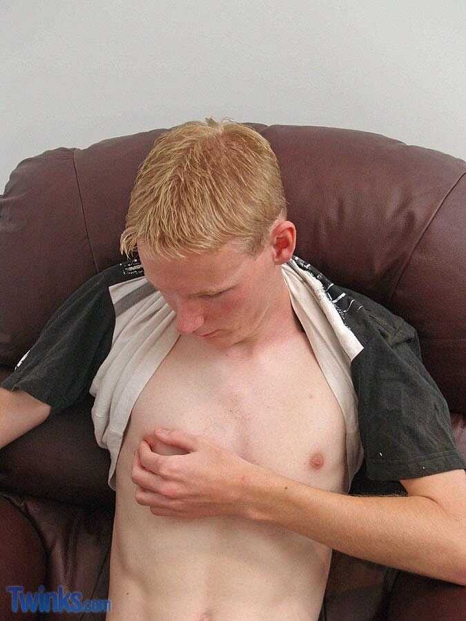 Barely legal blonde twink jacks off in front of the mirror with his big ass while singing gay cock tunes. - 