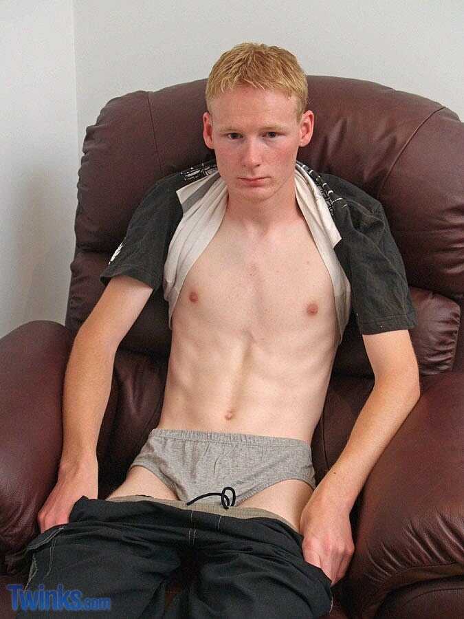 Barely legal blonde twink jacks off in front of the mirror with his big ass while singing gay cock tunes. - 