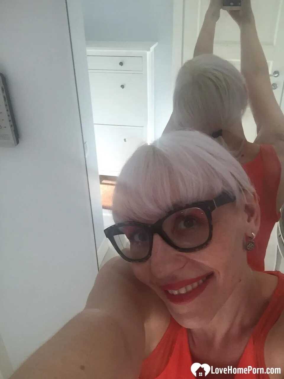 Bent Over Big Tit Blonde Nerd MILF Takes a Sexy Selfie