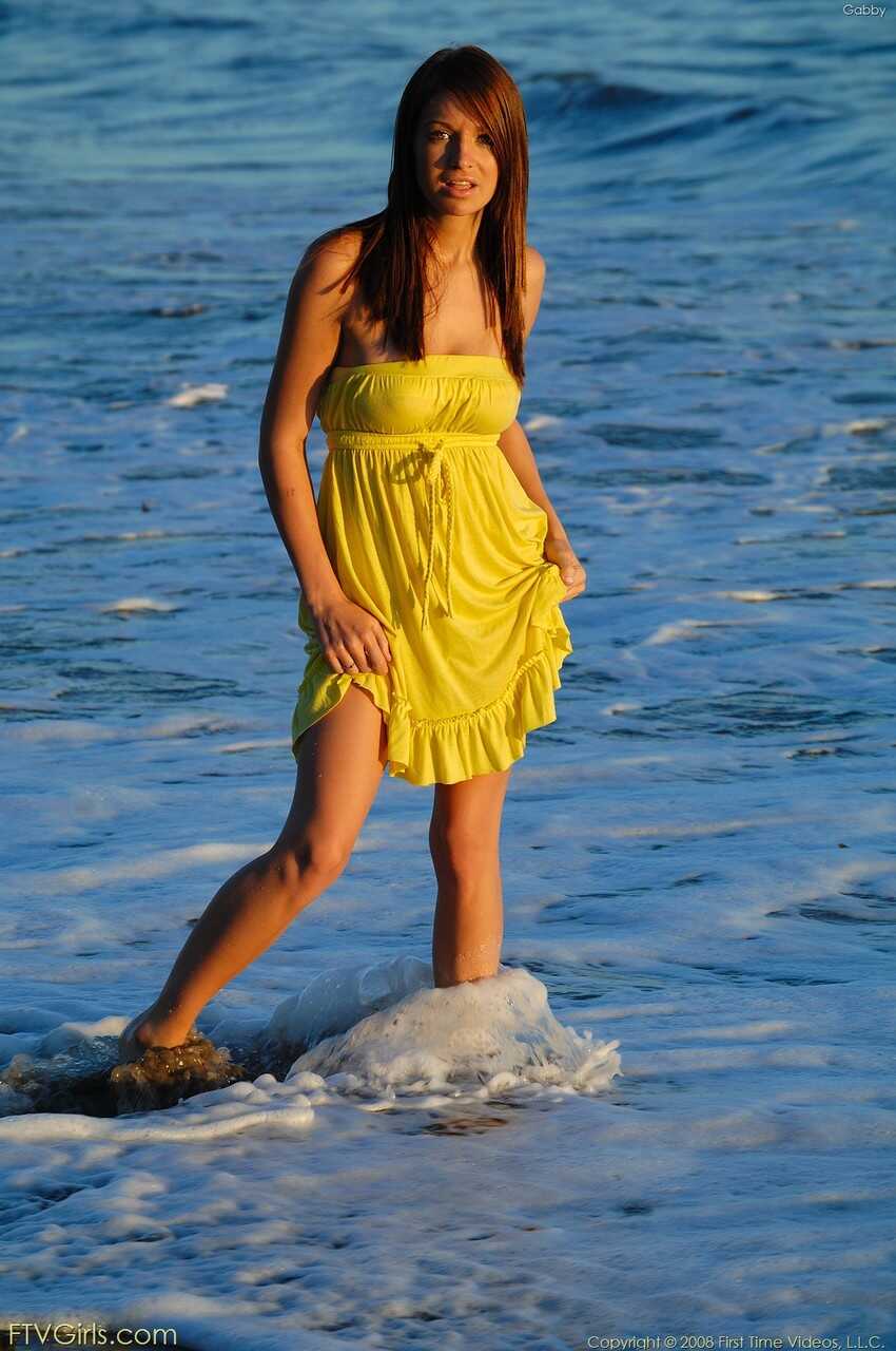 Glamour babe Gabby shows her cuddly tits in a yellow dress & heels outdoors - Gabby
