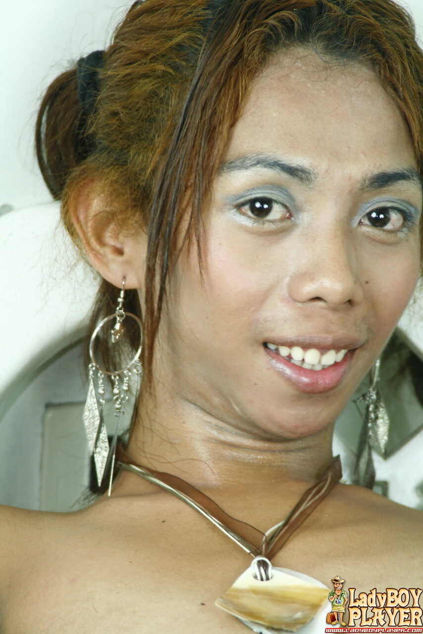Naughty Lhara the Thai ladyboy strips and masturbates with a white dildo and her tiny dick! - Lhara