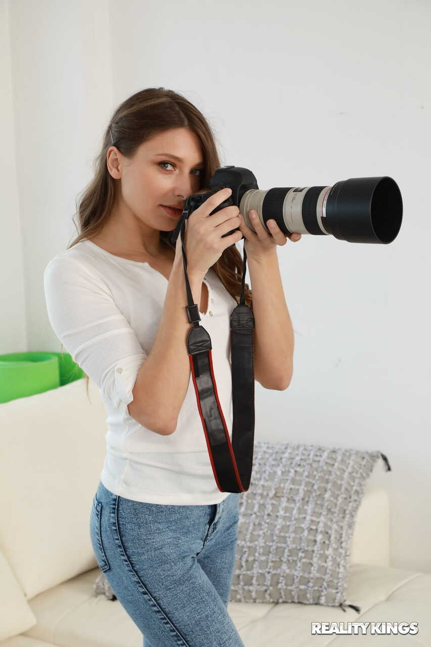 Fit Baby Nicols strips and makes love to her lesbian photographer Talia Mint, exposing her juicy jeans ass for some hot le...