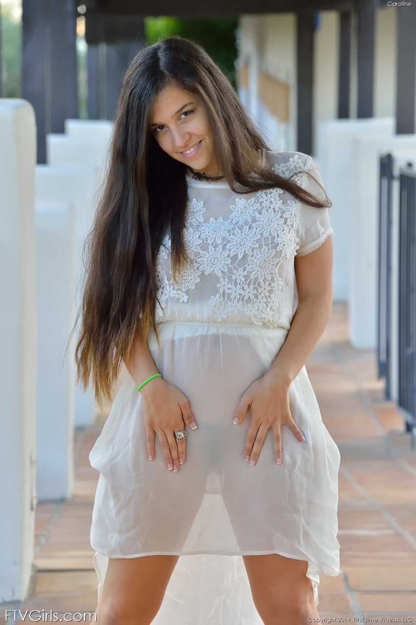 Busty teen babe Caroline lifts her dress up in public and inserts a banana in her fuzzy pussy for some innocent fun - Caro...
