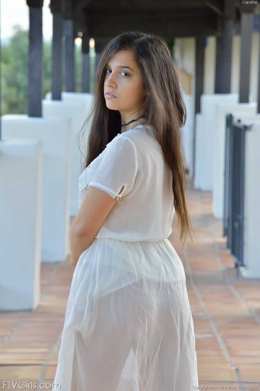 Busty teen babe Caroline lifts her dress up in public and inserts a banana in her fuzzy pussy for some innocent fun - Caro...