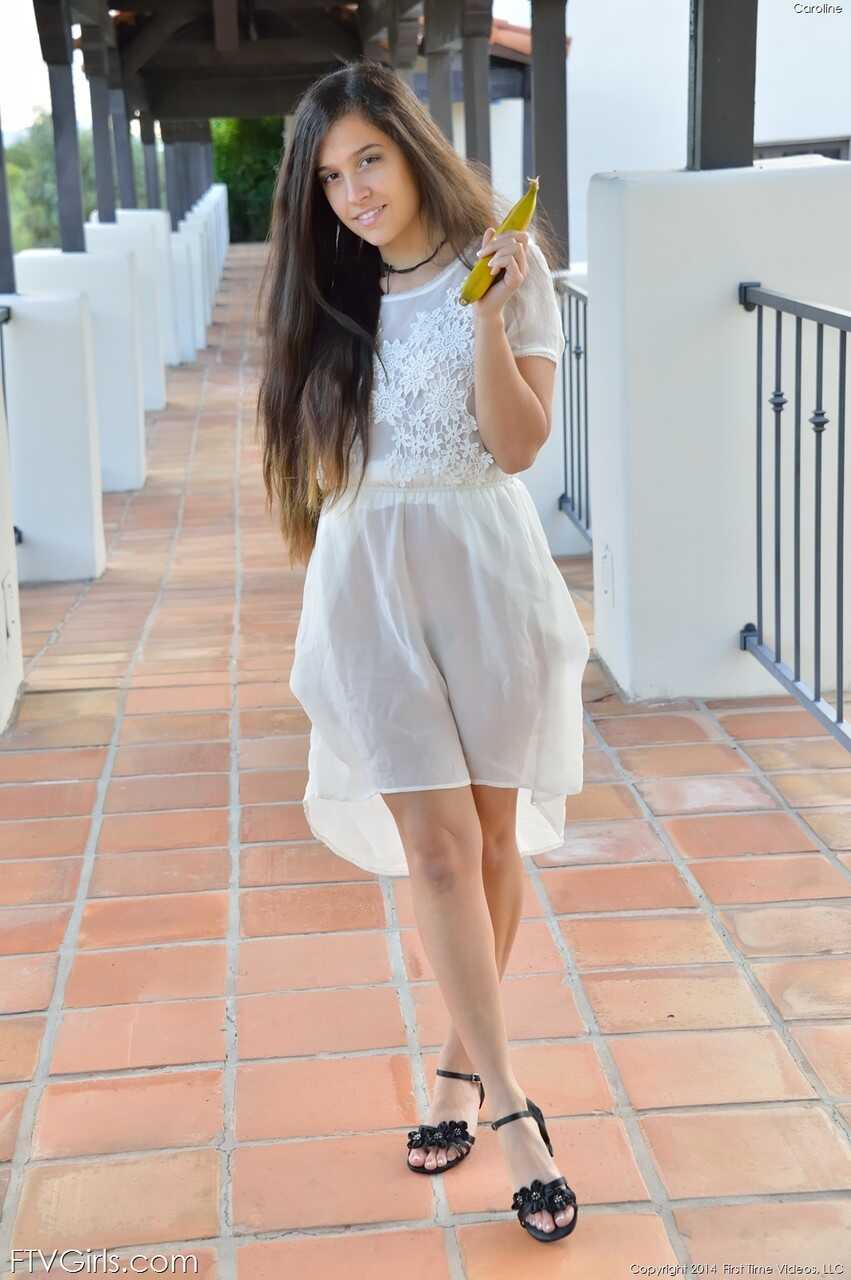 Busty teen babe Caroline lifts her dress up in public and inserts a banana in her fuzzy pussy for some innocent fun - Caro...