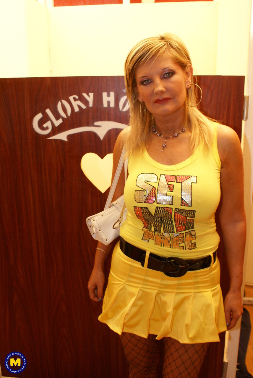 Kailey The Mature Nympho Licks Her Big Tits And Sucks Dick Through Gloryhole