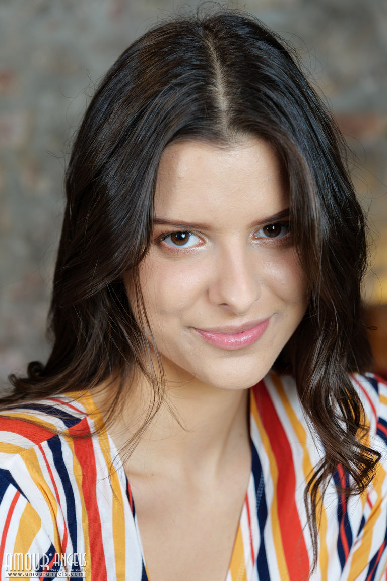 Young Brunette Amelia Grace Slowly Undresses On Top Of A Wooden Trunk