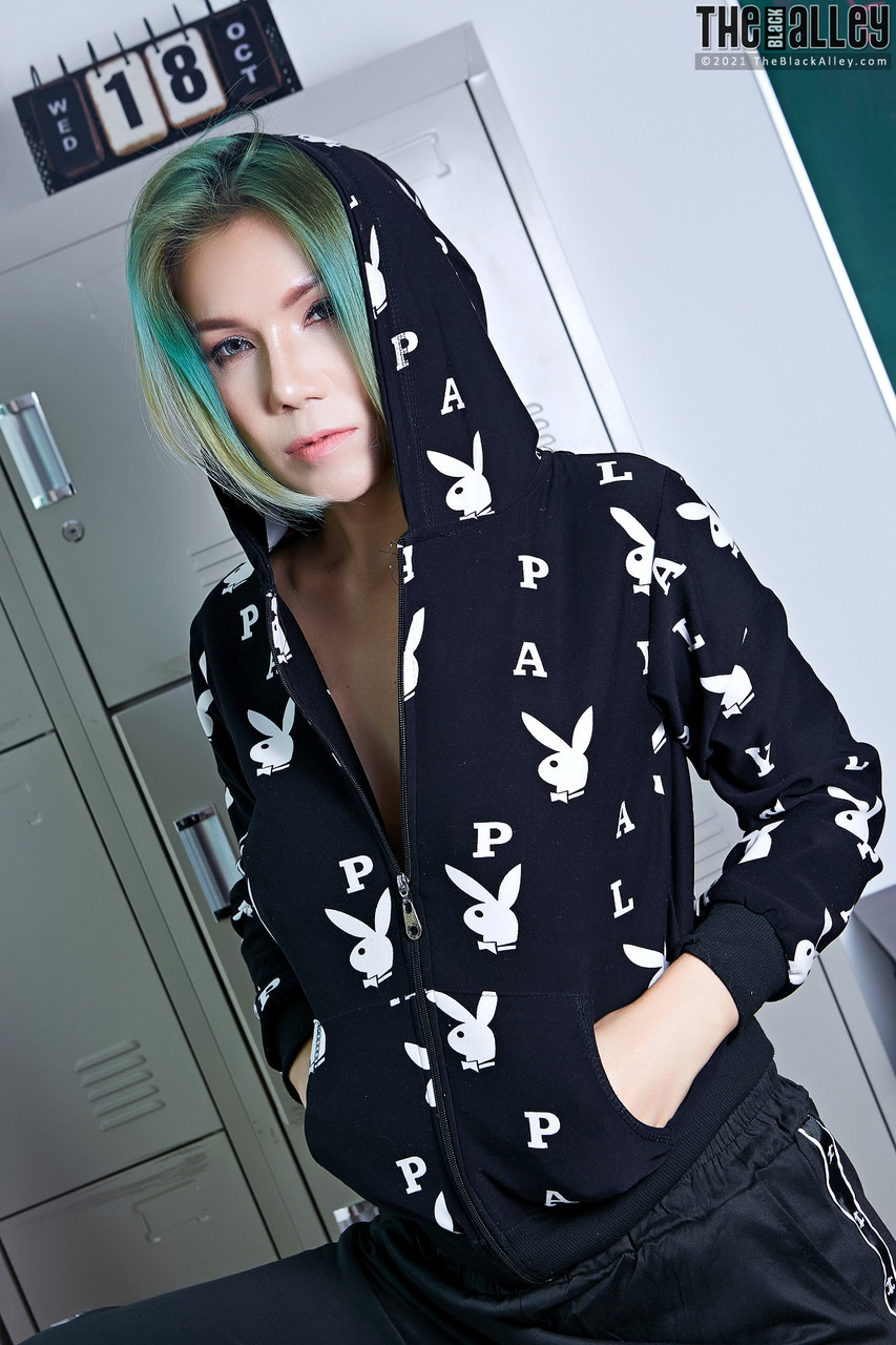 Asian Chick Janya Holds Tennis Racquet While Getting Partially Undressed