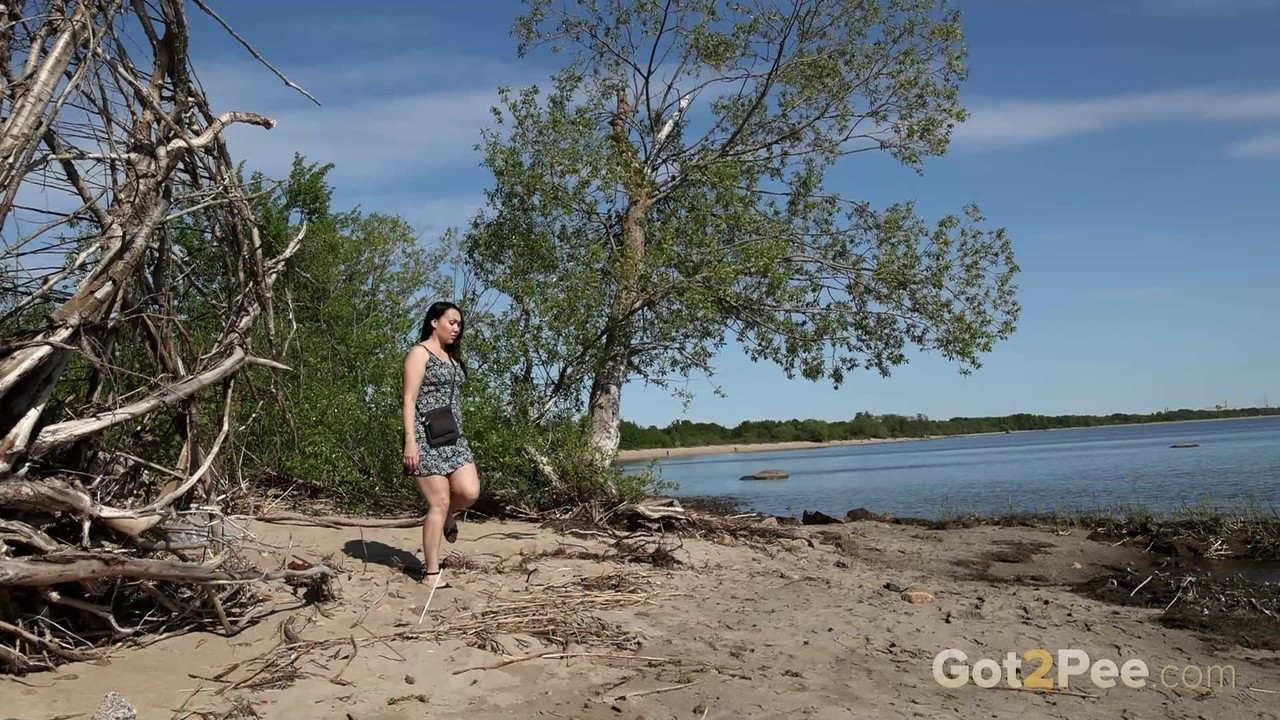 Brunette Chick Anarid Gets Caught Pissing On A Beach During The Day
