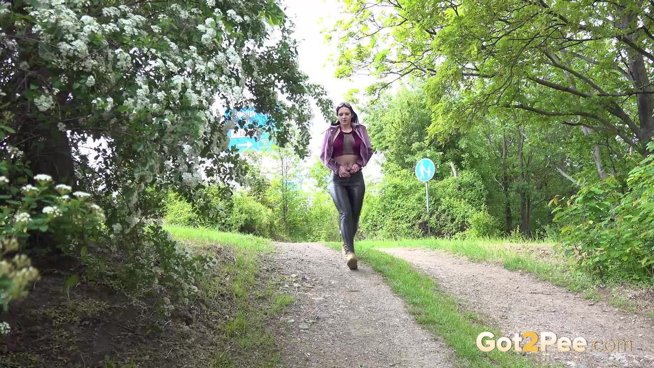 Isabel Dark Pees On Dirt Road After Pulling Down Leather Pants