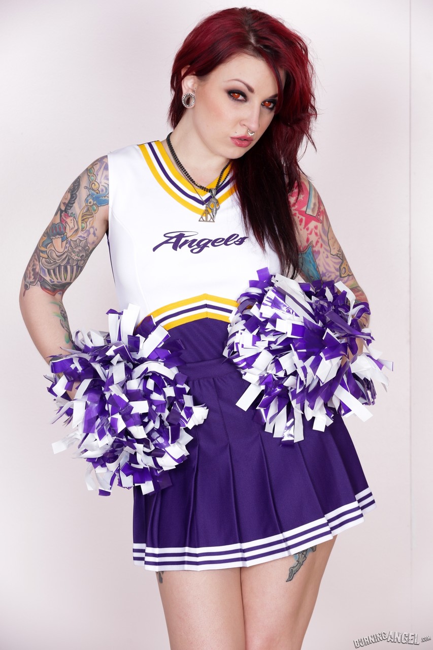 Tattooed Cheerleader Draven Star Strips Uniform And Poses Seductively