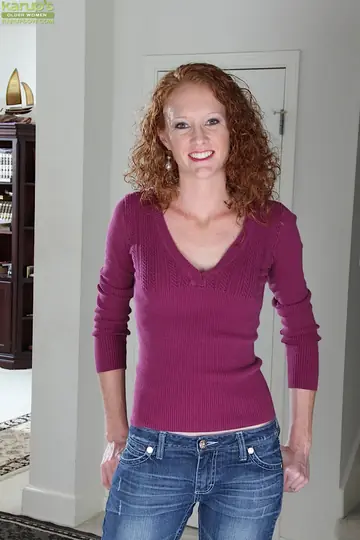 Skinny Mature Redhead Undresses in Jeans on the Stairs