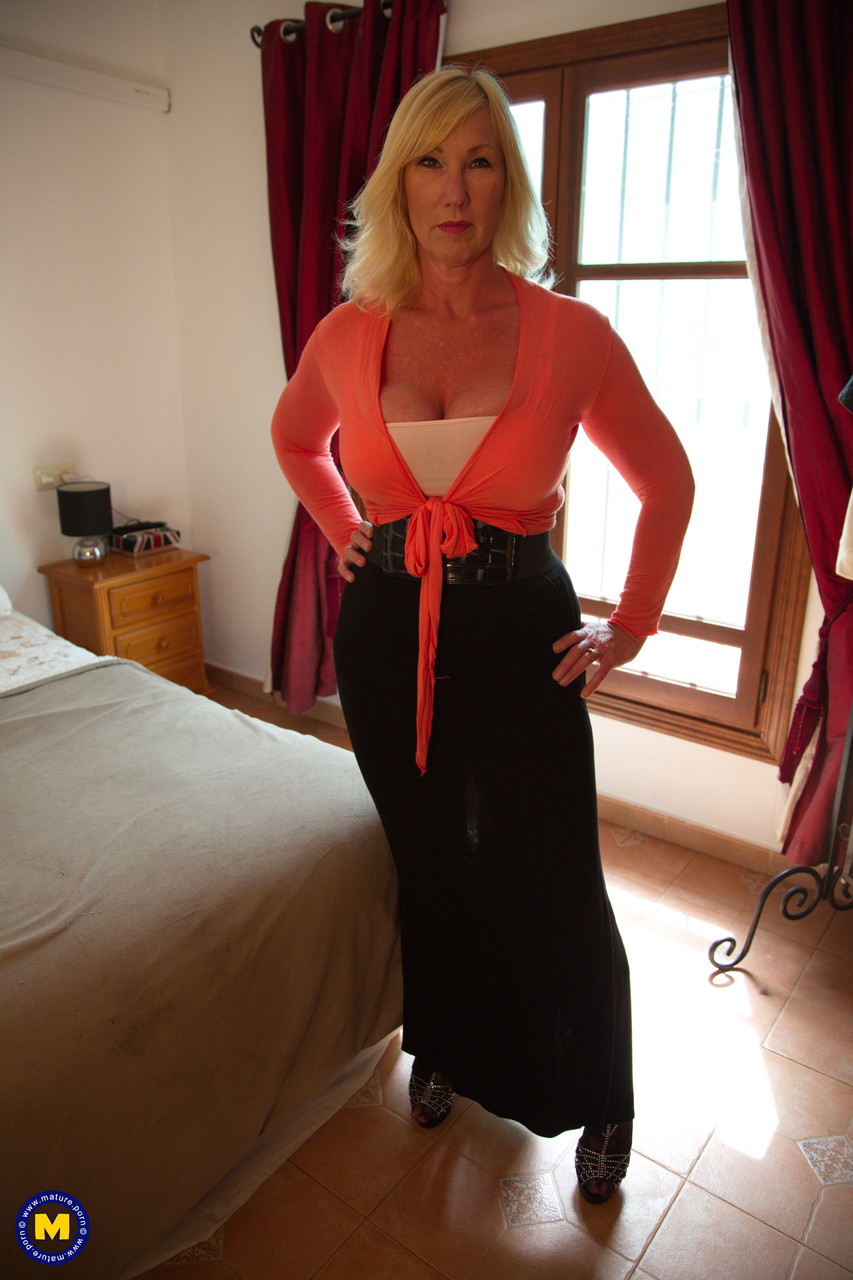 Blonde Mature Melody Charm Reveals Big Naturals Before Masturbating