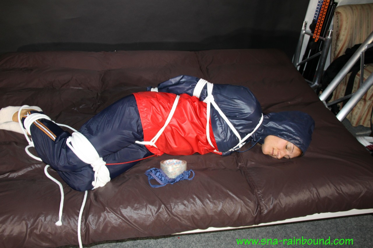 Bound And Gagged White Girl Sandra In Nylon Rainwear