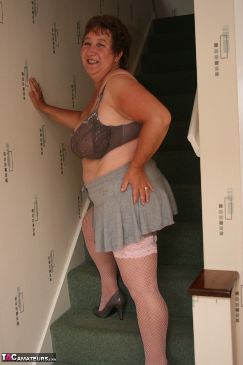 Kinky Mature Woman Shows Huge Tits In Upskirt Action