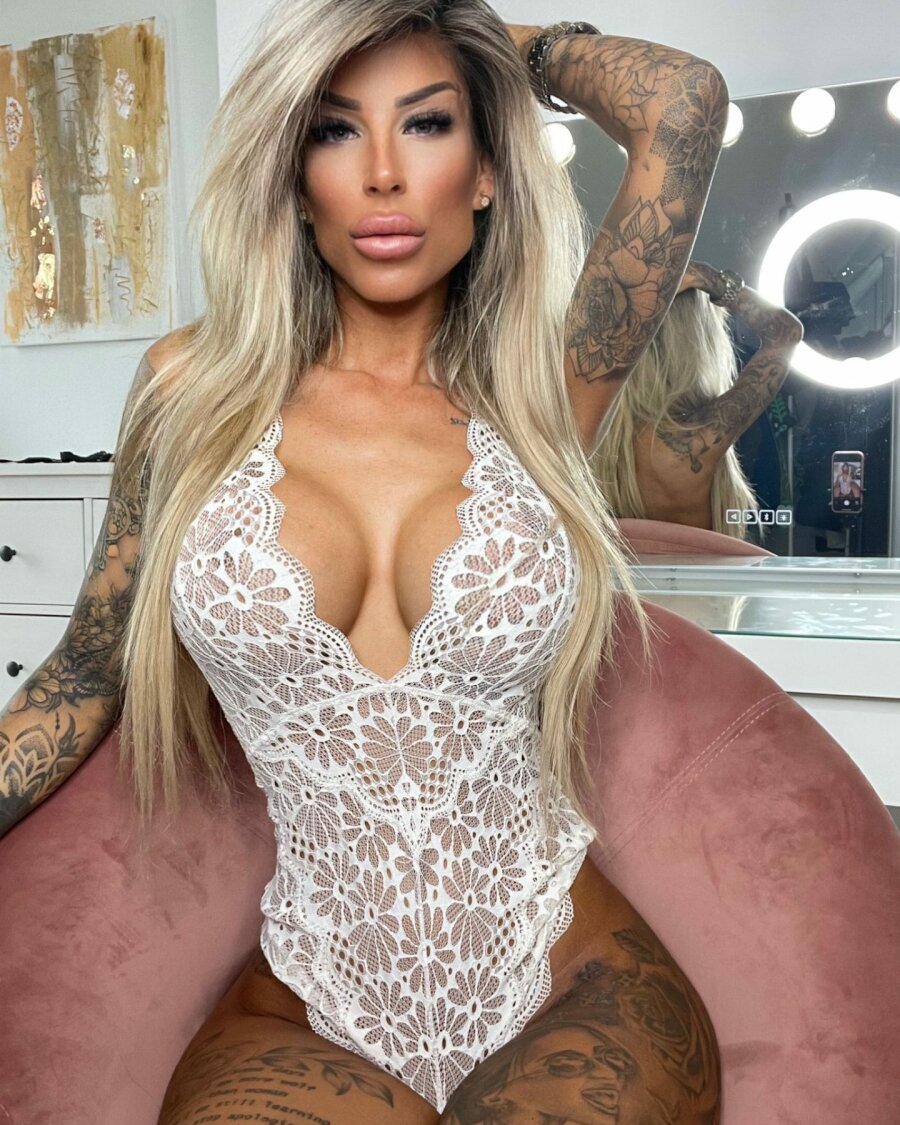 Amateur Tattooed Babe Covers Her Great Juggs And Poses Solo