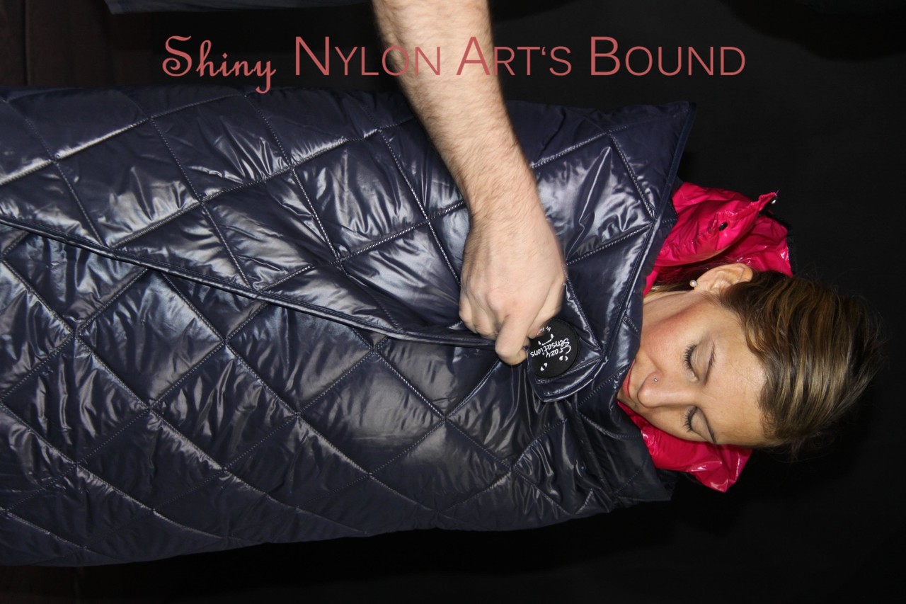 White Girl Bound In Down Cover And Nylon Jacket