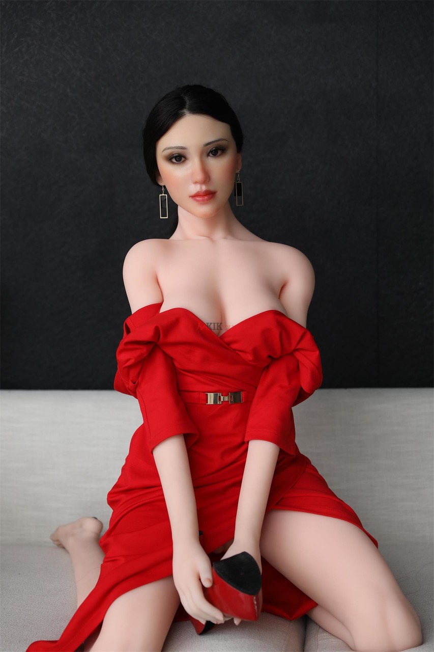 Leggy Realistic Sex Doll Rayna Doffs Red Dress And Poses Naked