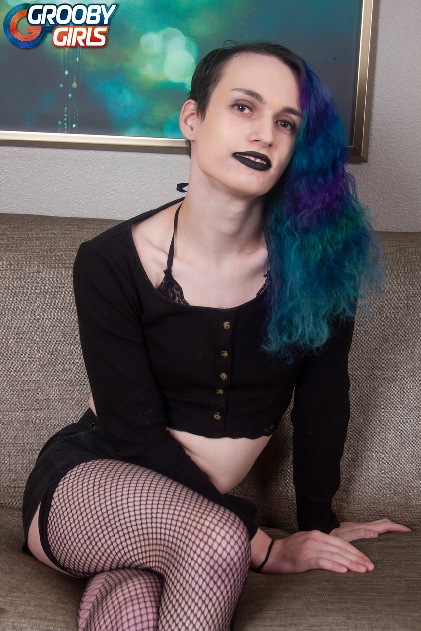 Blue-Haired Shemale Mercy Strips To Fishnet Stockings And Masturbates
