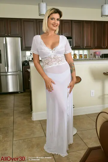 Brandon Areana – Tattooed Blonde MILF Bares Her Big Tanned Tits in the Kitchen