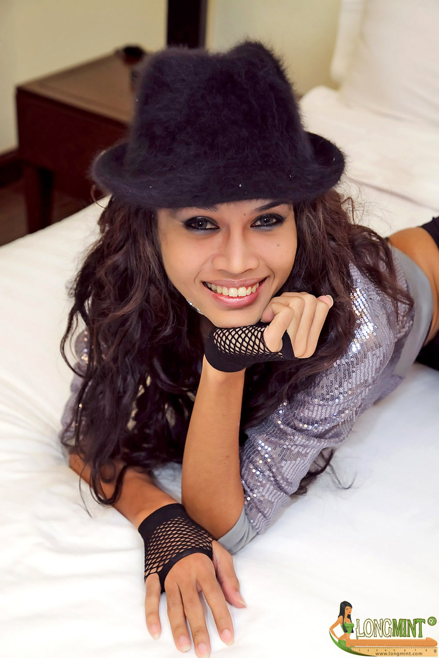 Pretty Asian Shemale Shows Off Her Big Dick In Stockings And High Heels