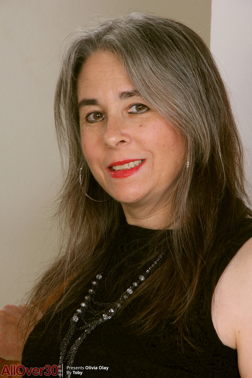 Mature Lady Olivia Olay Strips Naked And Spreads Her Hairy Pussy Wide