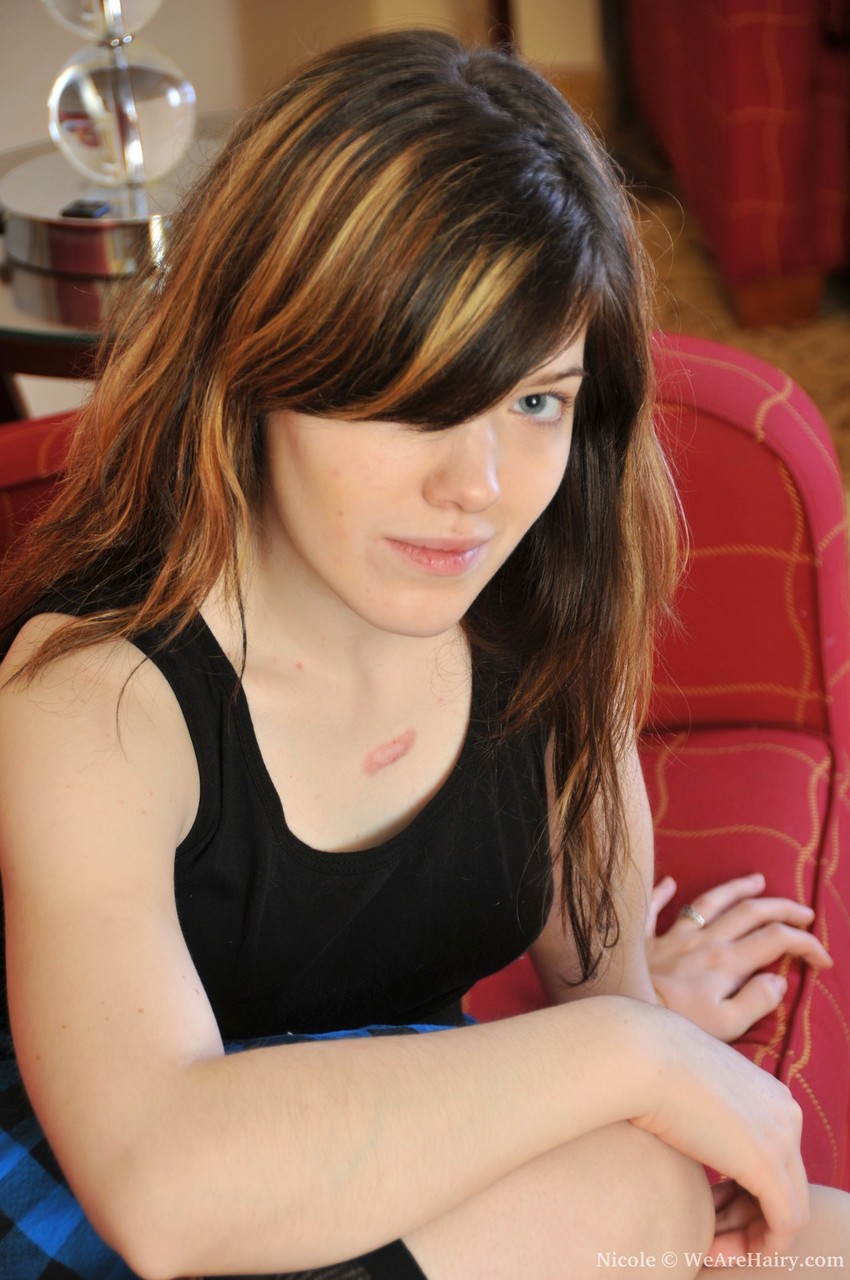 Amateur Solo Girl Shows Off Her Hairy Muff On Red Sofa In Boots