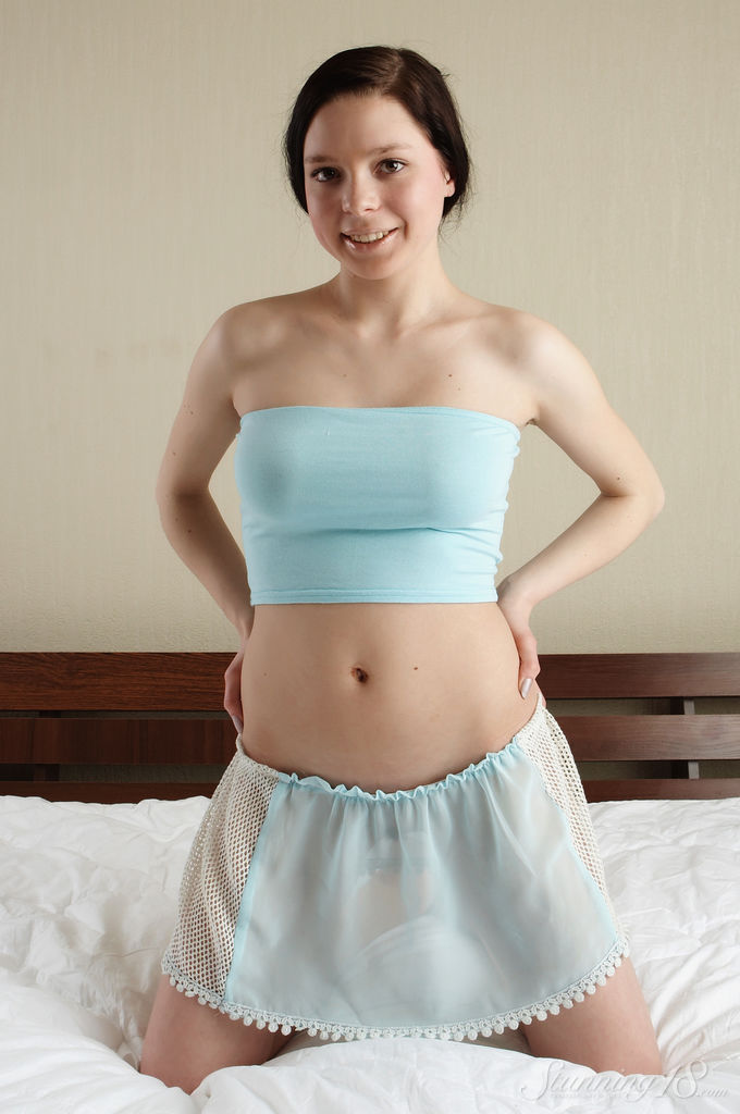 Teen Kelly K Shows Perky Tits As She Strips From Tube Top