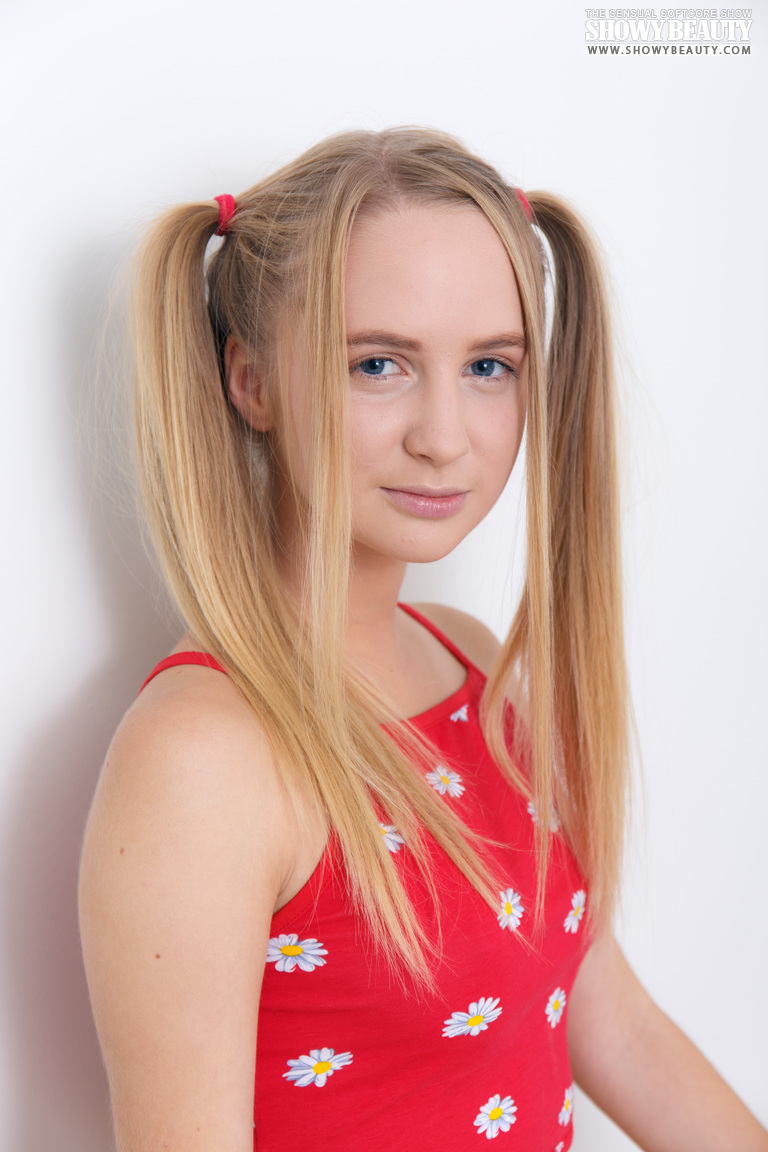 Adorable Teen Layza Cradles Her Firm Tits With Long Pigtails