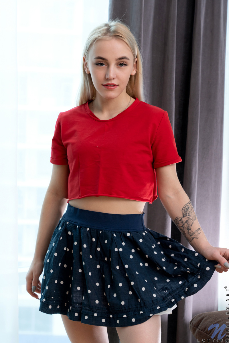 Young Blonde Lottie Disrobes Before Touching Her Horny Vagina On Sofa