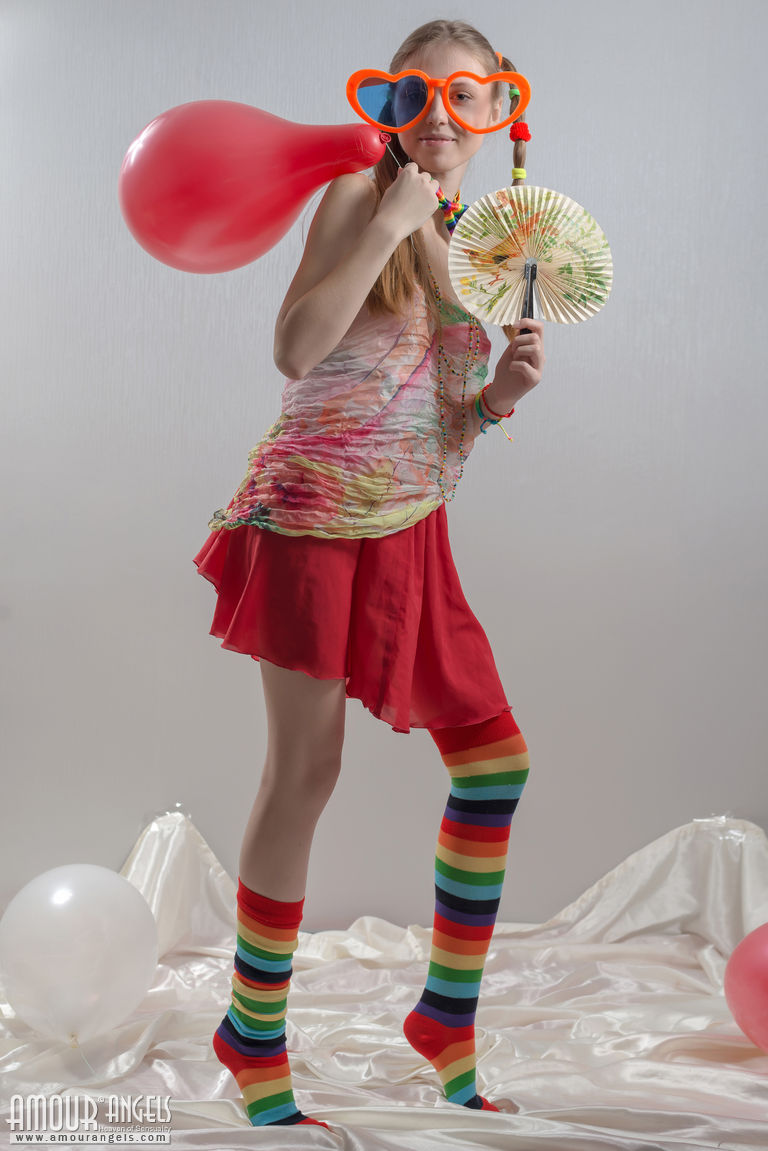 Slim Teen In Pigtails And Rainbow Socks Strips