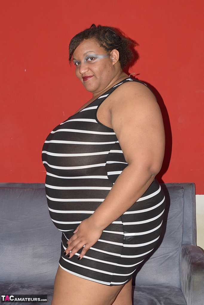 Curvy Black Obese Woman Oils Up Her Tits Before Toying Her Vagina