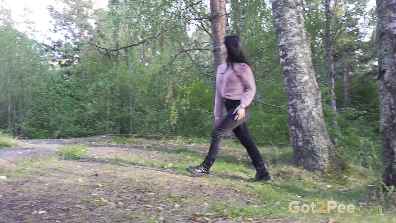 Dark-Haired Girl Pulls Down Black Jeans To Take A Piss Over Bank