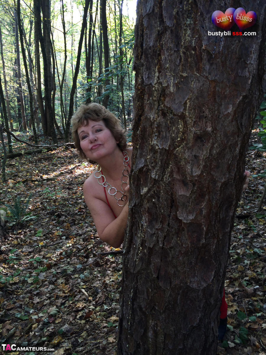 Busty Bliss: Naked Milf Exposes Big Tits In Forest